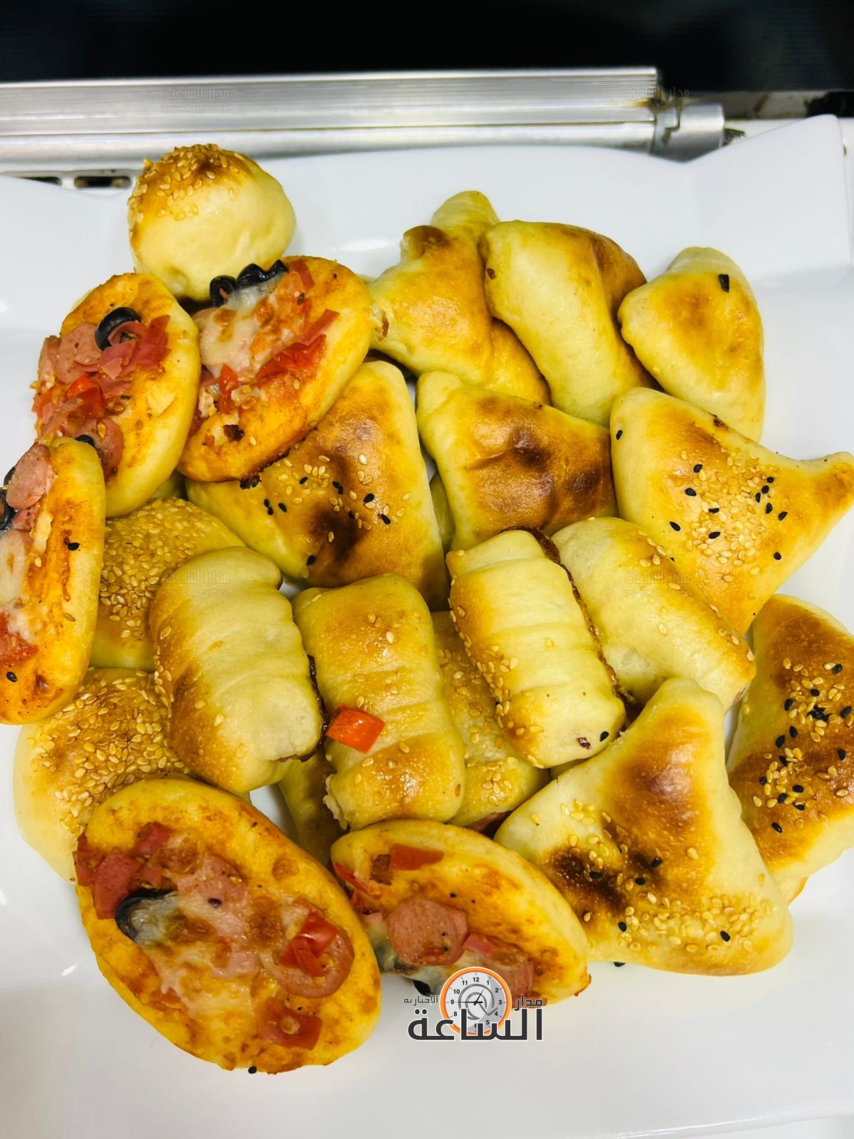 Madar Al-Saa Images 0.6524266622263262