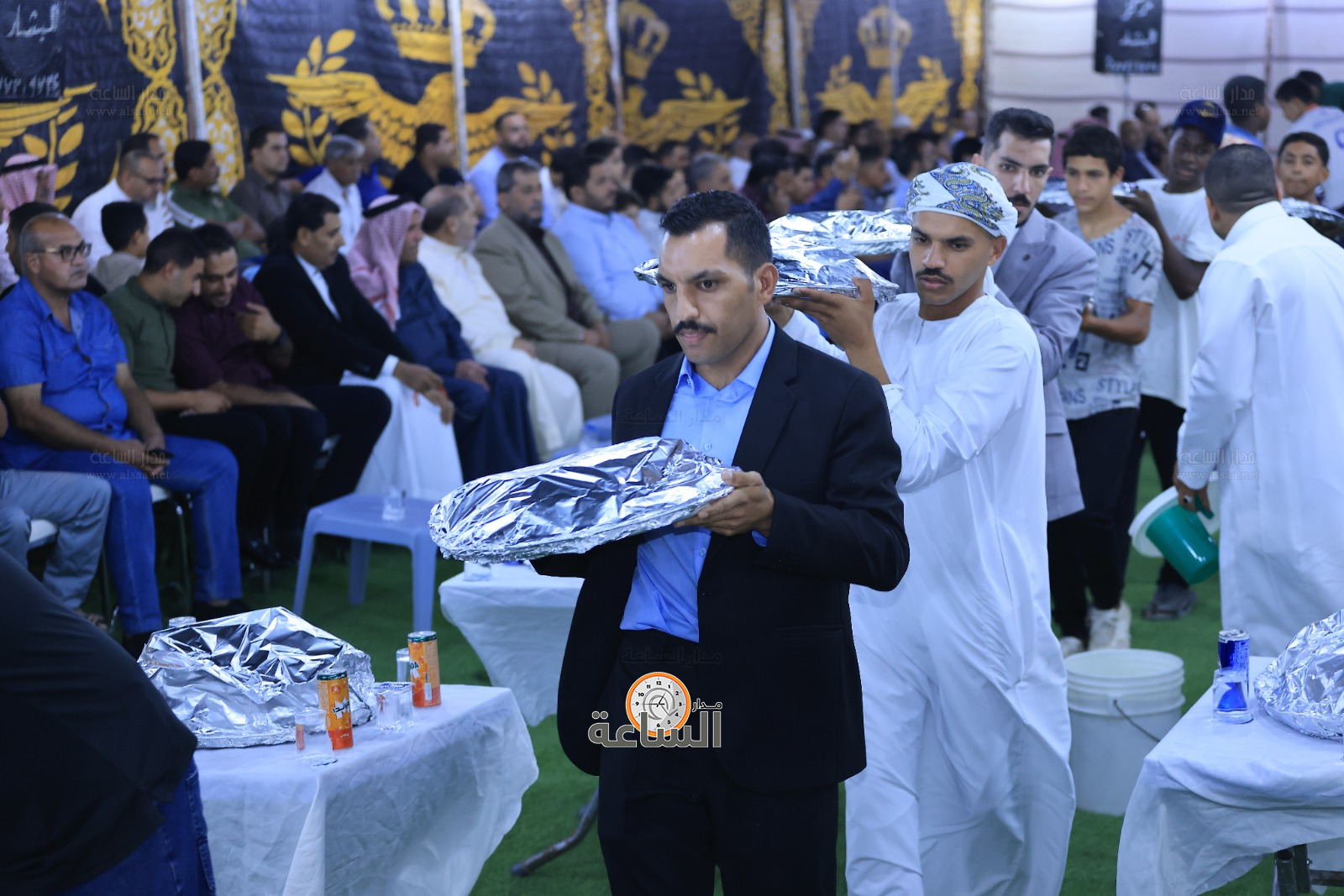 Madar Al-Saa Images 0.6636200904671242