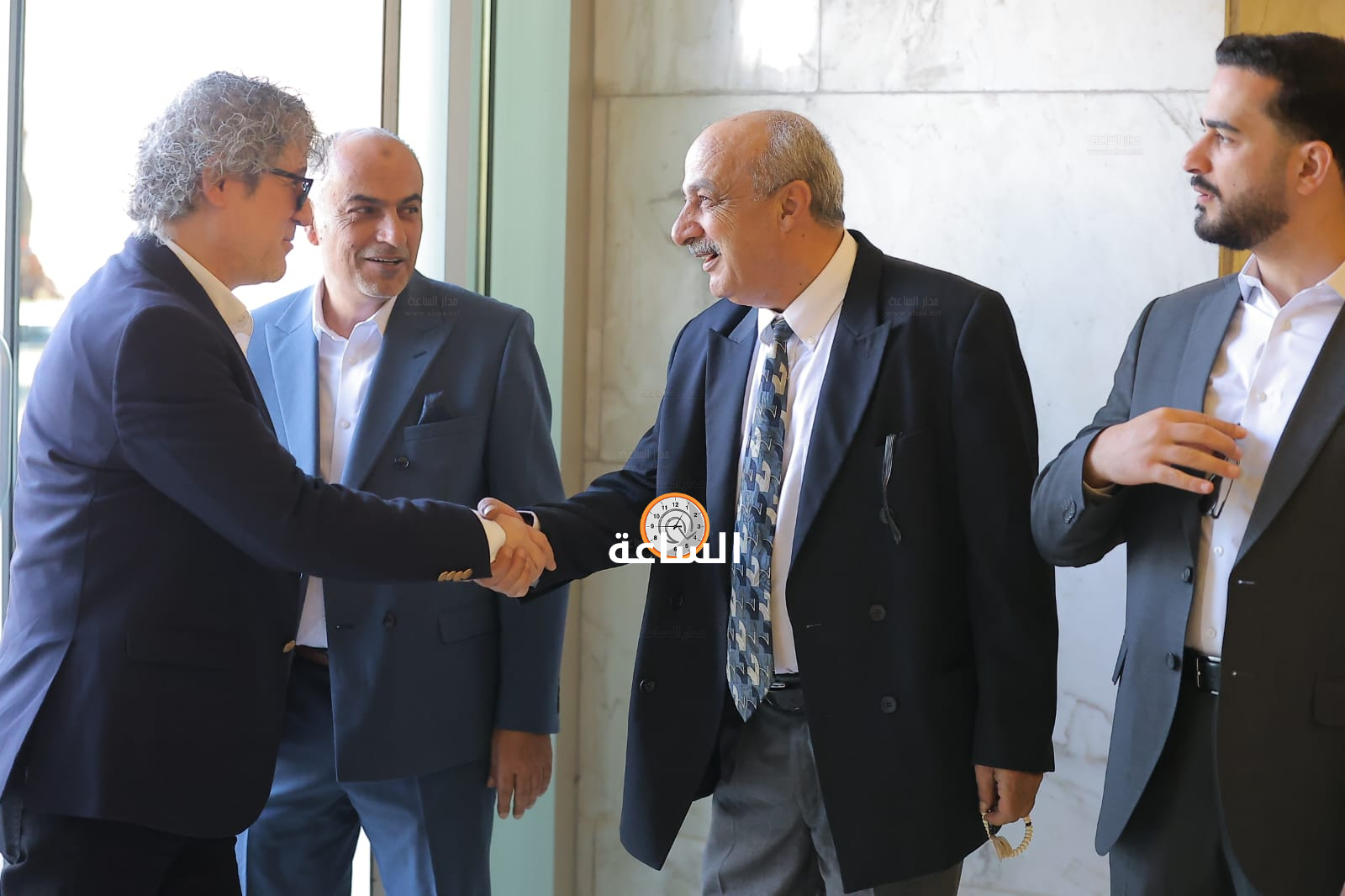 Madar Al-Saa Images 0.5006927340348919