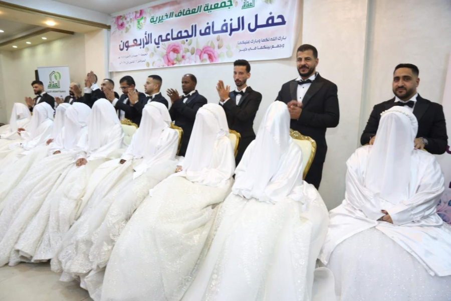 الأردن: زفاف جماعي لعشرين عريسا وعروسا