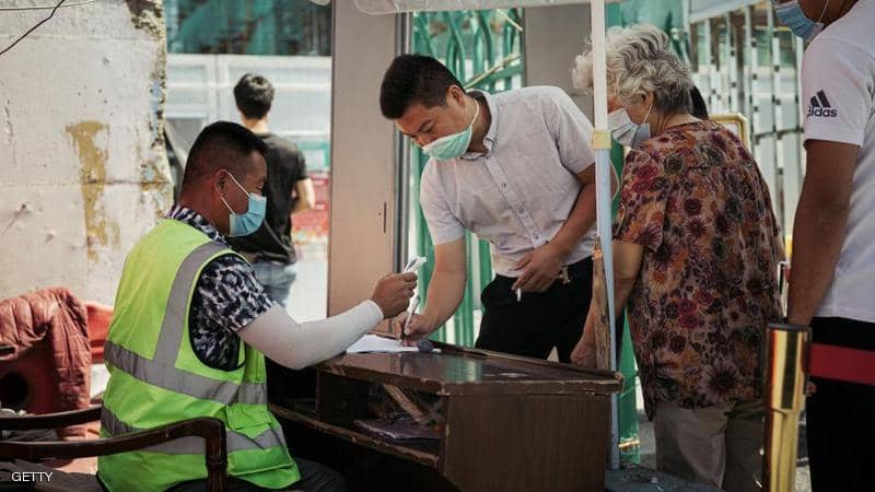 الصين تكافح بؤرة جديدة لكورونا