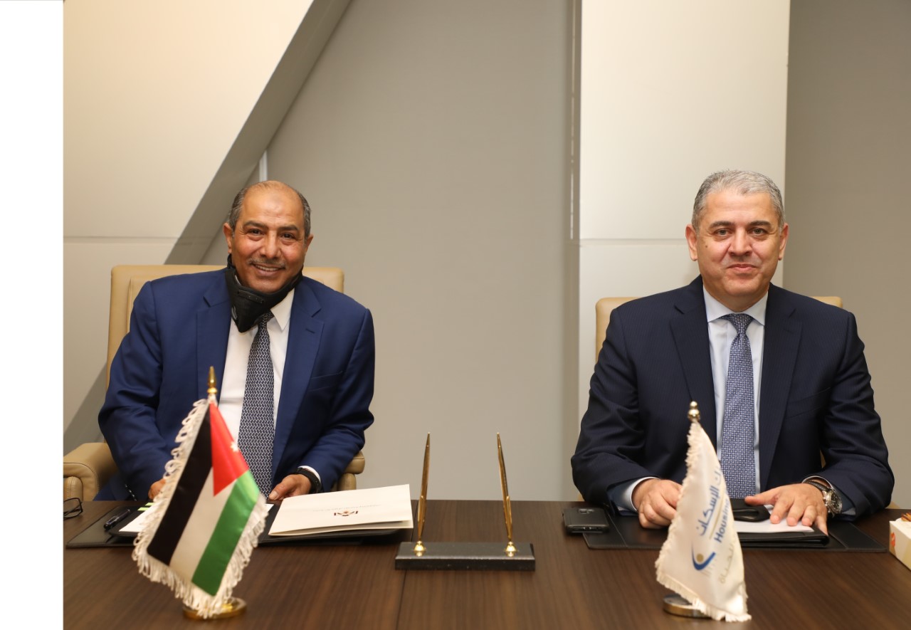 الأحوال المدنية والجوازات وبنك الاسكان يوقعان