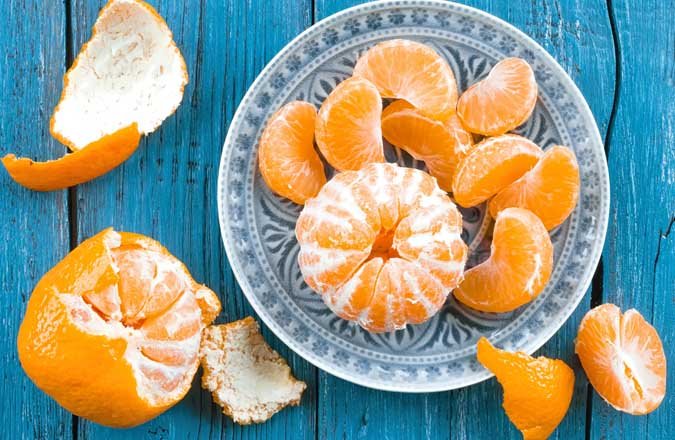 كيف وكم حبة مندرين يمكن تناولها